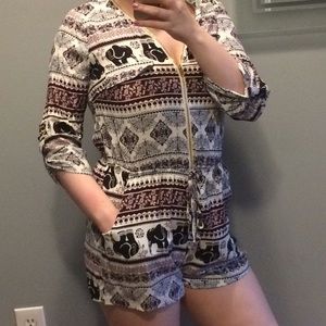 Purple elephant romper size small with gold zipper